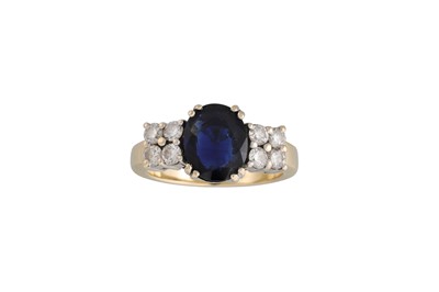 Lot 102 - A SAPPHIRE AND DIAMOND RING, the oval sapphire...