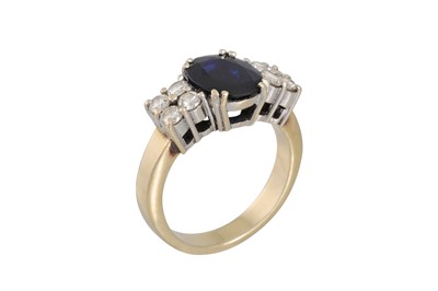 Lot 102 - A SAPPHIRE AND DIAMOND RING, the oval sapphire...
