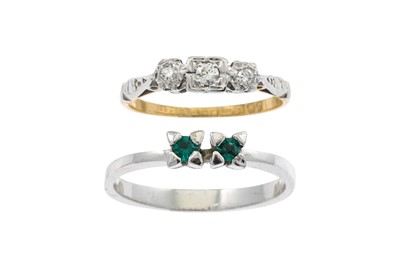 Lot 188 - A DIAMOND SET THREE STONE RING, mounted in...