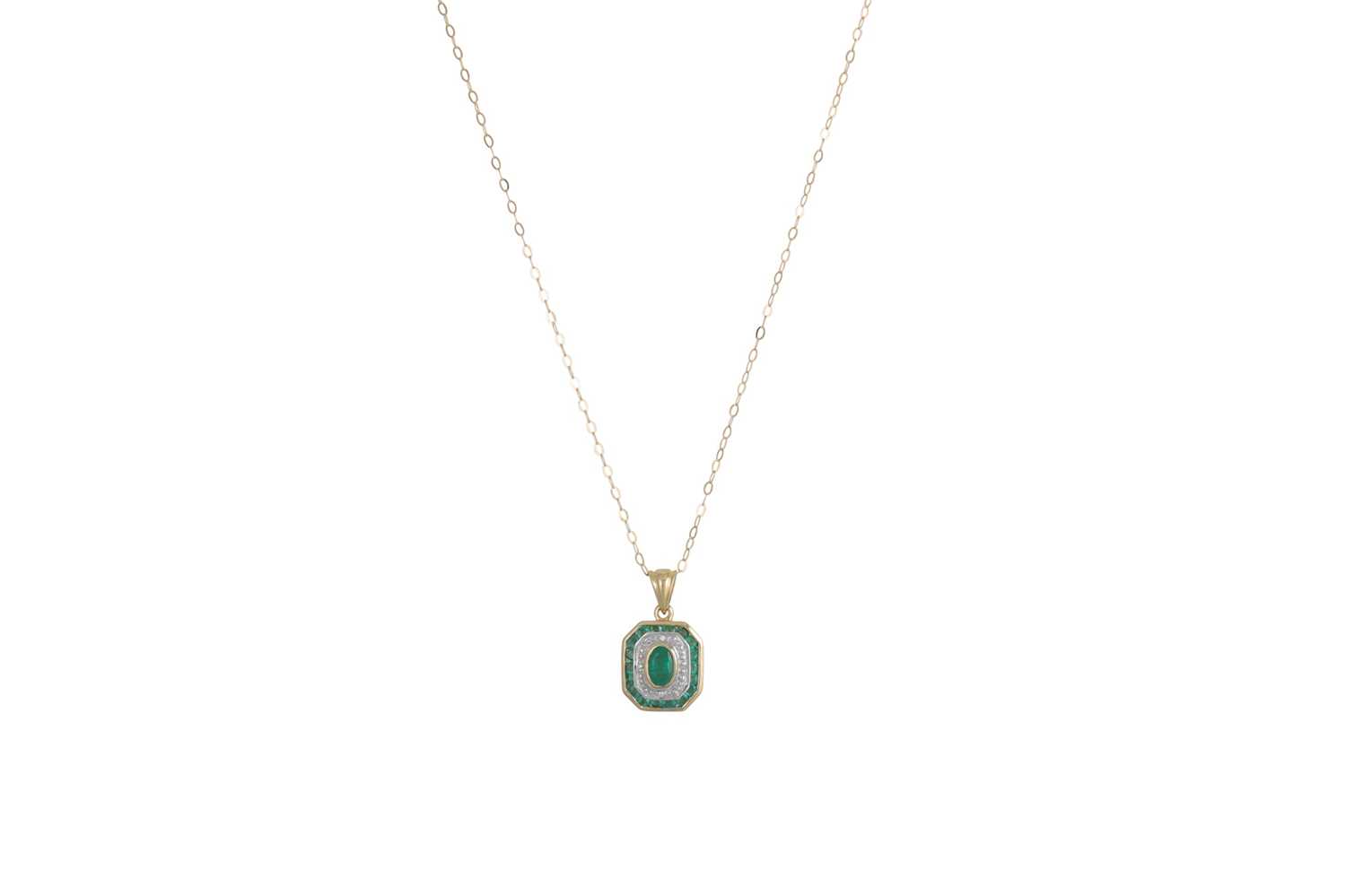 Lot 24 - A DIAMOND AND EMERALD PENDANT, the central...