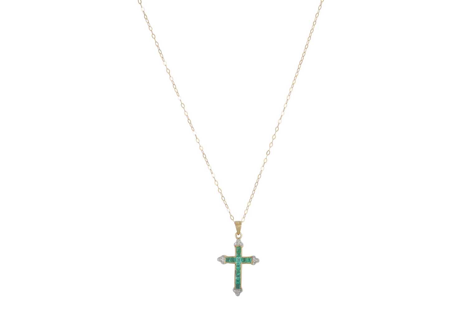 Lot 27 - AN EMERALD AND DIAMOND CROSS, set with...