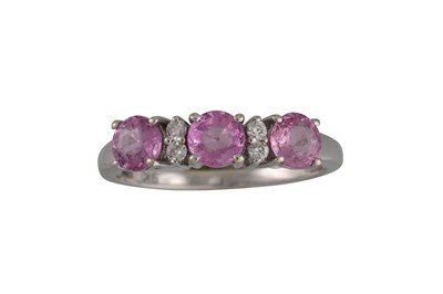 Lot 28 - A DIAMOND AND PINK SAPPHIRE RING, in 9ct white...