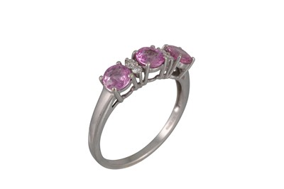 Lot 28 - A DIAMOND AND PINK SAPPHIRE RING, in 9ct white...