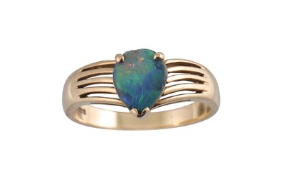 Lot 171 - A BOULDER OPAL RING, the pear shaped opal...