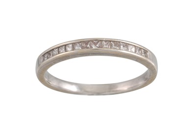 Lot 174 - A DIAMOND HALF ETERNITY RING, channel set with...
