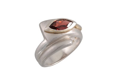 Lot 117 - A GARNET AND SILVER DRESS RING, the marquise...