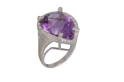 Lot 92 - AN AMETHYST AND DIAMOND CLUSTER RING, the pear...