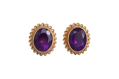 Lot 97 - A PAIR OF AMETHYST STUD EARRINGS, the oval...