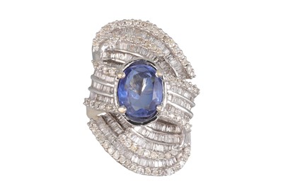 Lot 104 - A DIAMOND AND SAPPHIRE CLUSTER RING, the oval...