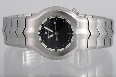 Lot 409 - A LADY'S TAG HEUER WRIST WATCH, black face,...