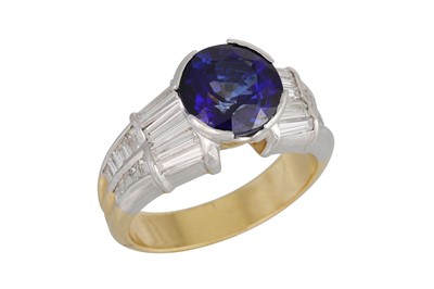 Lot 143 - A DIAMOND AND TANZANITE RING, the round...
