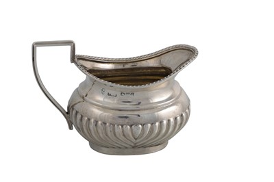 Lot 530 - A VICTORIAN SILVER GADROONED CREAM JUG,...