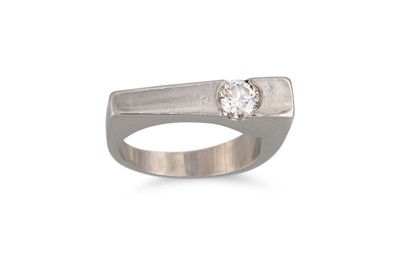 Lot 14 - A HEAVY PLATINUM RING, set with a brilliant...