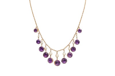 Lot 67 - AN ANTIQUE 15CT GOLD AMETHYST AND PEARL FRINGE...