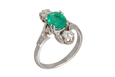 Lot 223 - AN EMERALD AND DIAMOND THREE STONE RING, of up...
