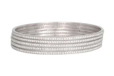 Lot 26 - A SET OF FIVE DIAMOND SET BANGLES, mounted in...
