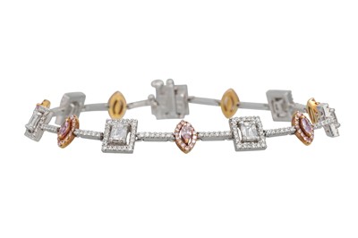 Lot 30 - A WHITE AND PINK DIAMOND BRACELET, of cluster...