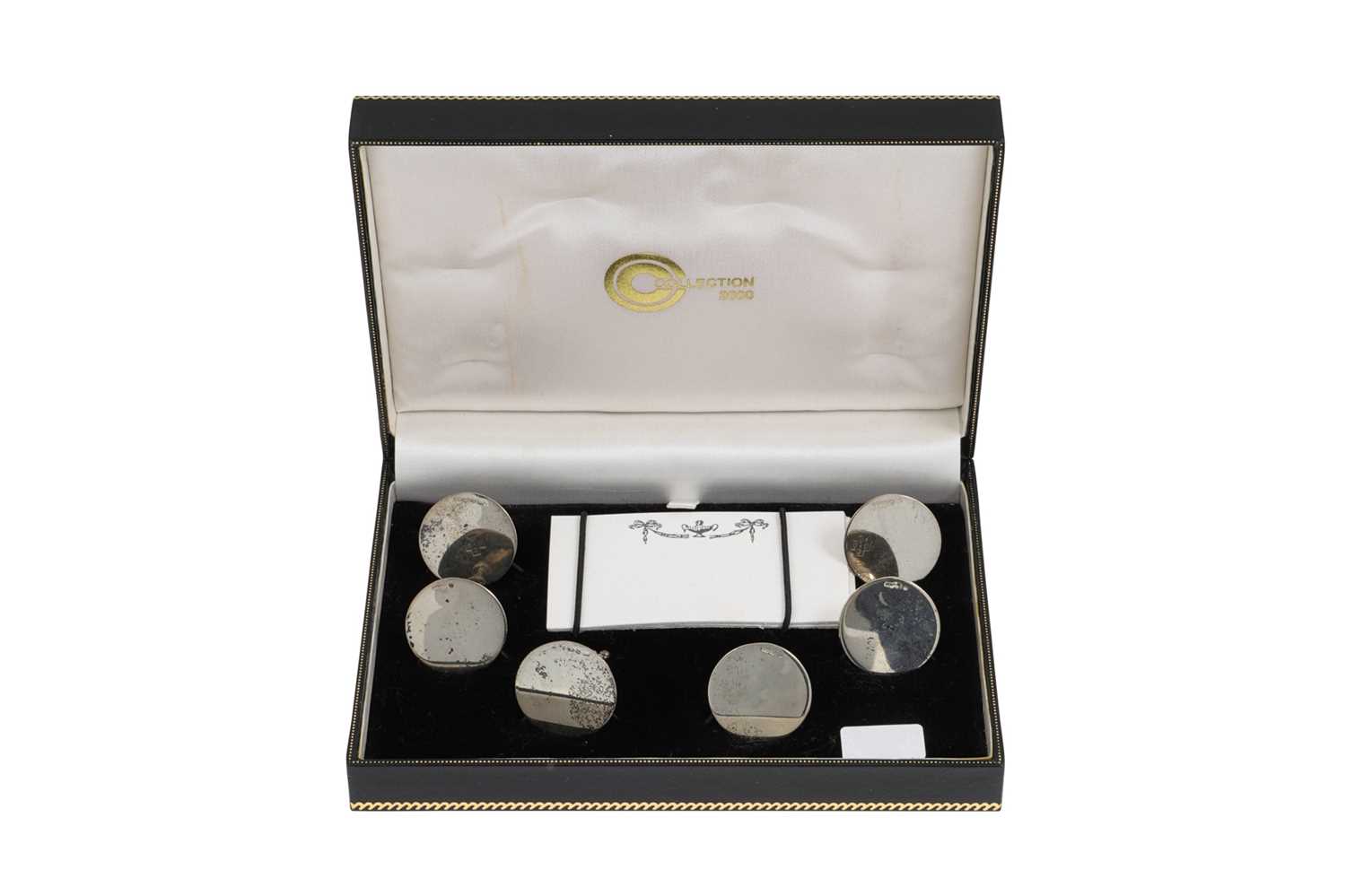 Lot 515 - A CASED SET OF SIX SILVER PLACE MARKERS, 48 g.