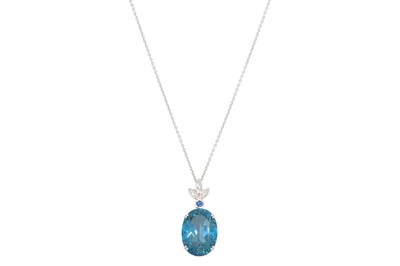 Lot 310 - A LARGE BLUE TOPAZ, the oval stone mounted in...