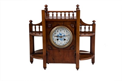 Lot 451 - AN EDWARDIAN WALNUT CASED MANTLE CLOCK, with...