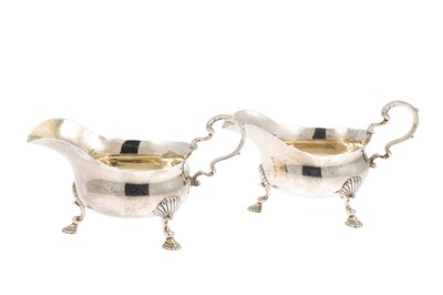 Lot 518 - A PAIR OF SILVER HELMET SHAPED SAUCE BOATS,...