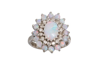Lot 21 - AN OPAL AND DIAMOND CLUSTER RING, the oval...