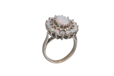 Lot 21 - AN OPAL AND DIAMOND CLUSTER RING, the oval...