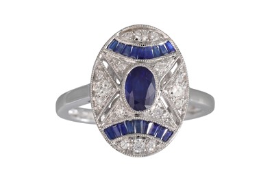 Lot 23 - A DIAMOND AND SAPPHIRE CLUSTER RING, the oval...
