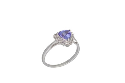 Lot 75 - A DIAMOND AND TANZANITE CLUSTER RING, the...