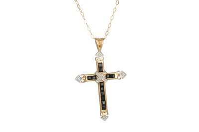 Lot 77 - A DIAMOND AND SAPPHIRE CROSS, the sapphires...