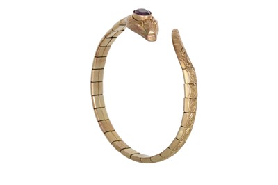 Lot 218 - A ROLLED GOLD BANGLE, in the form of a serpent,...