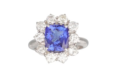 Lot 167 - A TANZANITE AND DIAMOND CLUSTER RING, the trap...