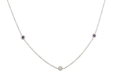 Lot 246 - A DIAMOND AND SAPPHIRE SET CHAIN, the collet...