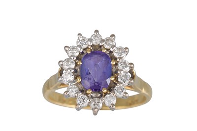 Lot 267 - A TANZANITE AND DIAMOND CLUSTER RING, the...
