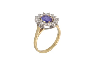 Lot 267 - A TANZANITE AND DIAMOND CLUSTER RING, the...