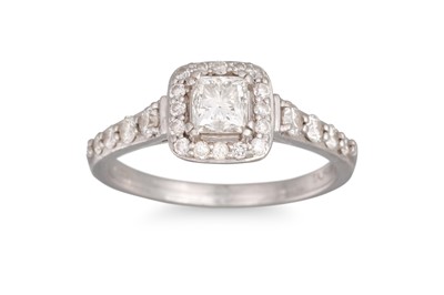 Lot 129 - A DIAMOND CLUSTER RING, the radiant cut...