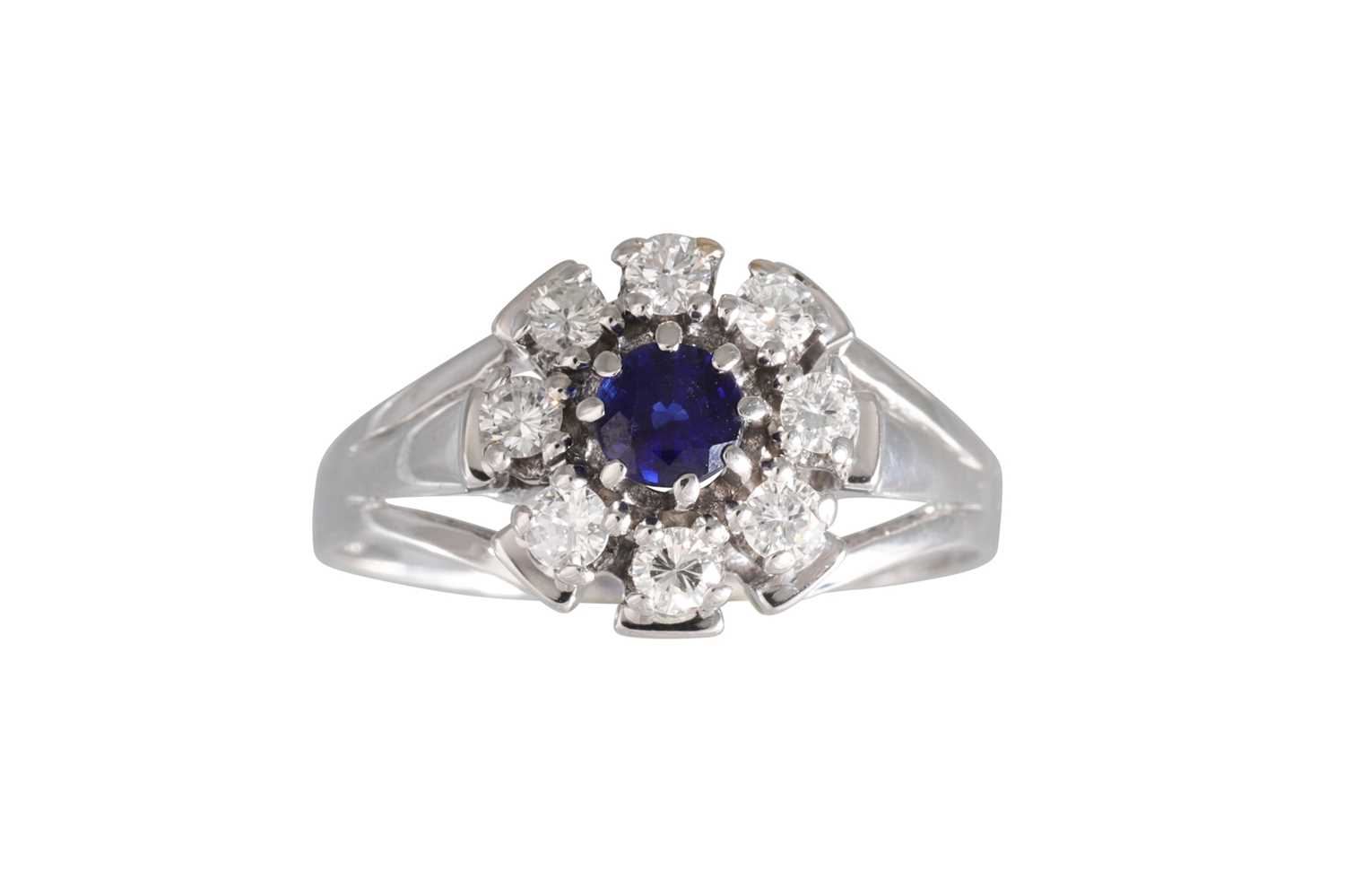 Lot 344 - A SAPPHIRE AND DIAMOND CLUSTER RING, set with...