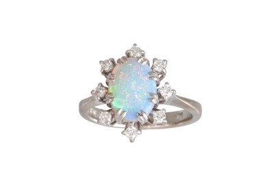 Lot 282 - AN OPAL AND DIAMOND CLUSTER RING, the dark...