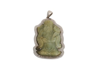 Lot 300 - A CHINESE STYLE CARVED JADE PENDANT, silver...