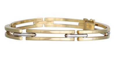 Lot 355 - AN 18CT YELLOW GOLD EXPANDABLE BANGLE, in two...
