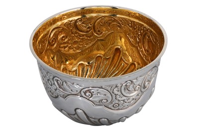 Lot 458 - A GEORGE V SILVER GILT BOWL, with embossed...