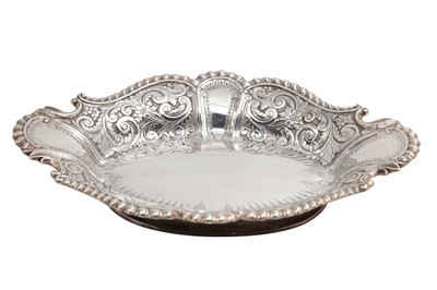 Lot 463 - A VICTORIAN SILVER EMBOSSED BREAD DISH, of...