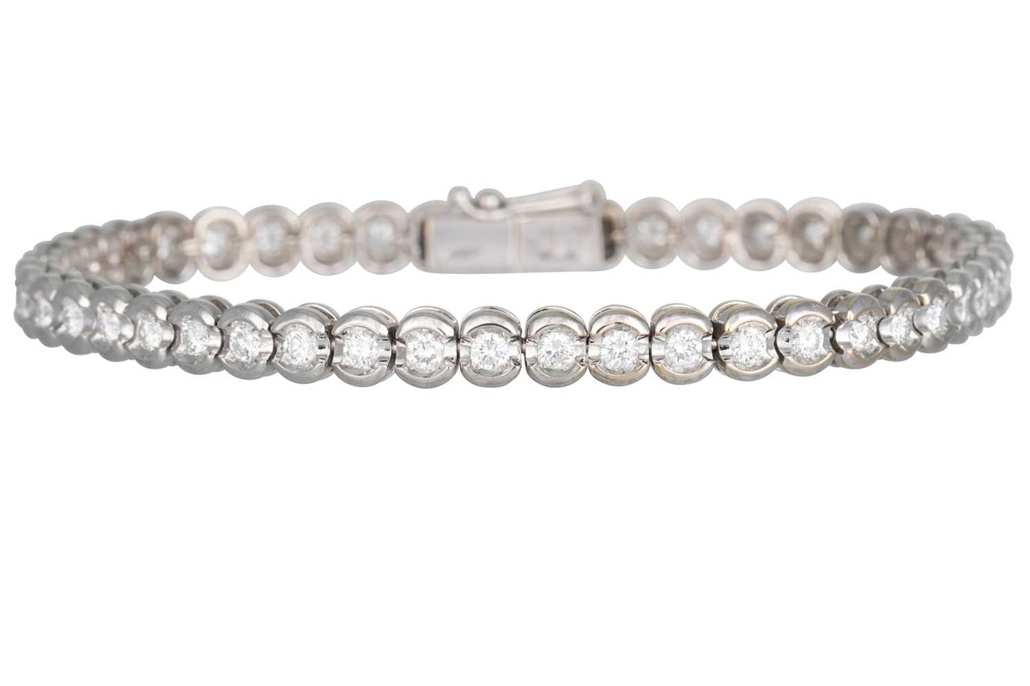 Lot 319 - A DIAMOND LINE BRACELET, by Damiani, the...