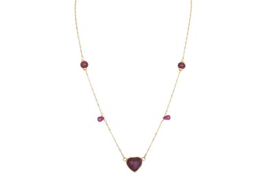 Lot 325 - A RUBY NECKLACE, the heart shaped cabochon...