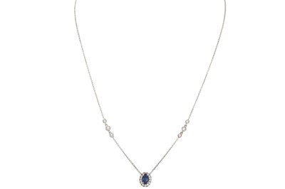 Lot 326 - A SAPPHIRE AND DIAMOND CLUSTER PENDANT, the...