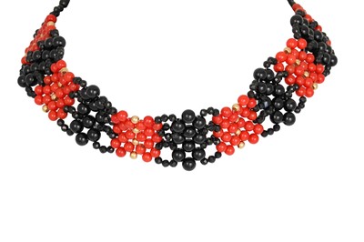 Lot 329 - AN ONYX AND CORAL BEADED COLLAR, yellow gold...