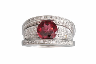 Lot 333 - A RHODOLITE AND DIAMOND RING, the circular...