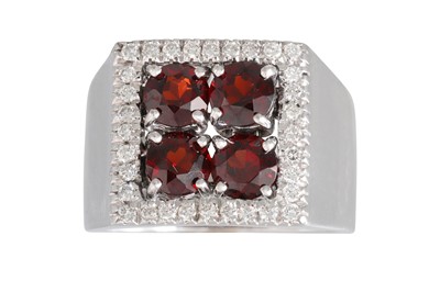 Lot 336 - A GARNET AND DIAMOND CLUSTER RING, the four...