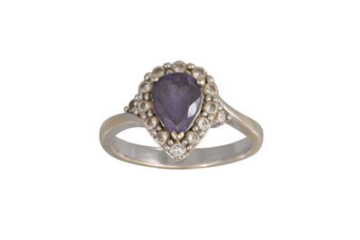 Lot 309 - A TANZANITE AND DIAMOND CLUSTER RING, the pear...