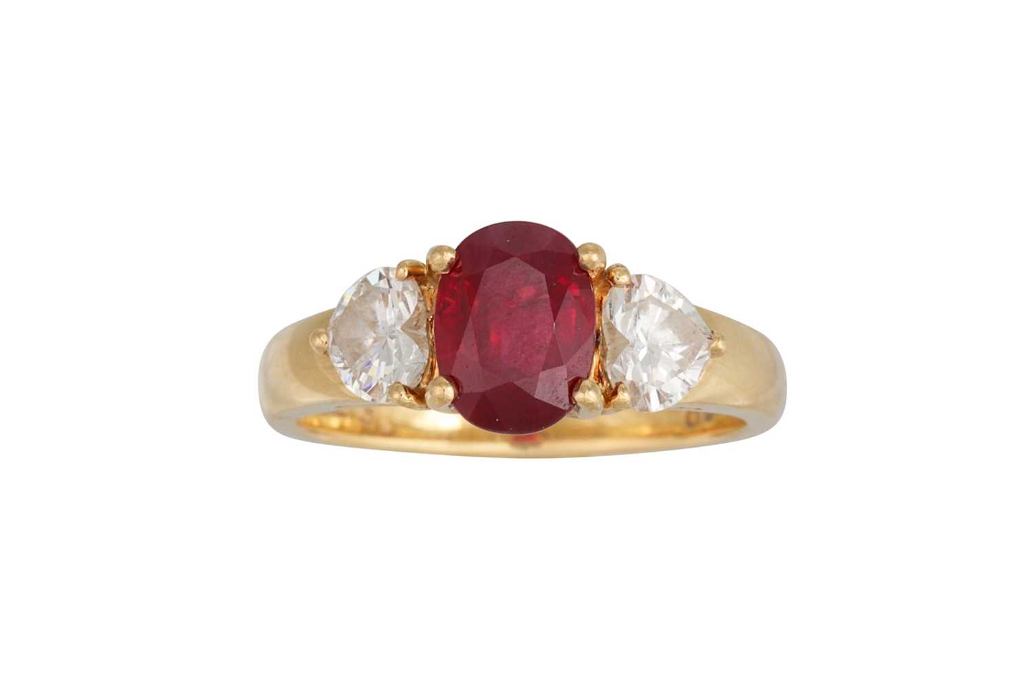 Lot 67 - A RUBY AND DIAMOND THREE STONE RING, the oval...